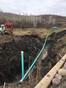 Perforated Catchment Pipe laying down water lines in Colorado